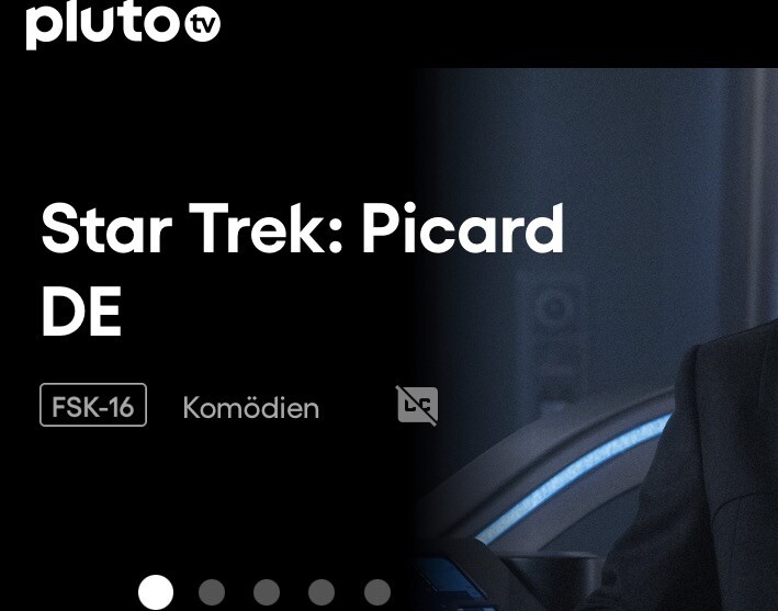 Screenshot Pluto.tv App. Überschrift „Star Trek Picard DE“. Darunter die Anmerkungen „FSK-16“, „Komödien“.